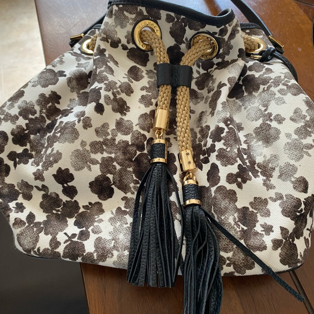 Cream bag with different shades of brown flowers